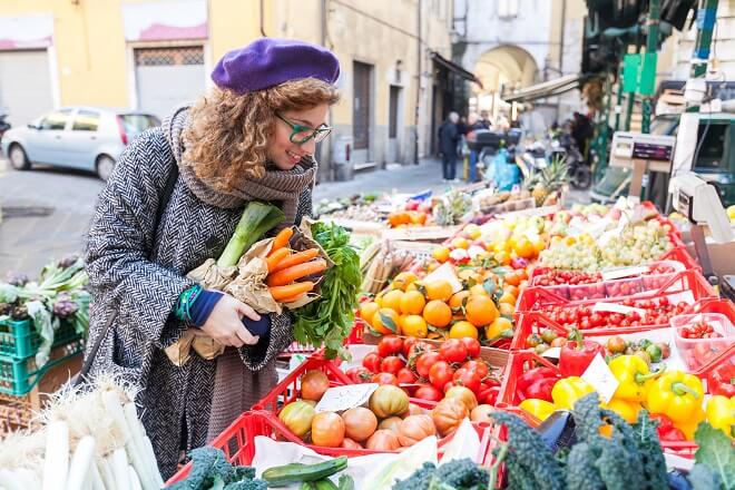 Young Woman Buying Vegetables at Local Market